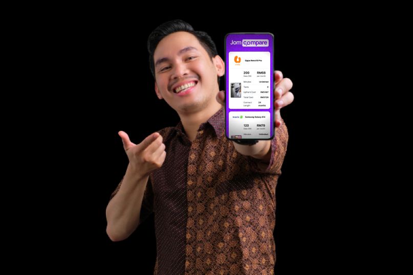 Malay man holding phone